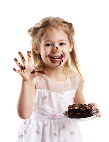 emotional portrait of a little girl with cake